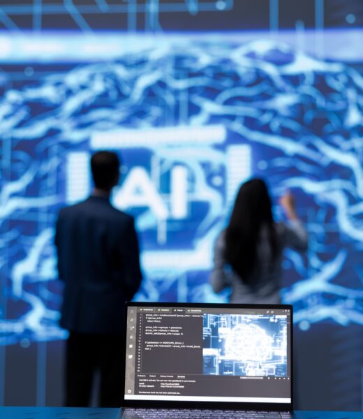 Focus on complex AI brain models being analyzed on laptop by developers